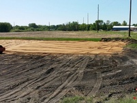 Hauling in and leveling sand