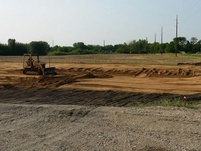 Hauling in and leveling sand